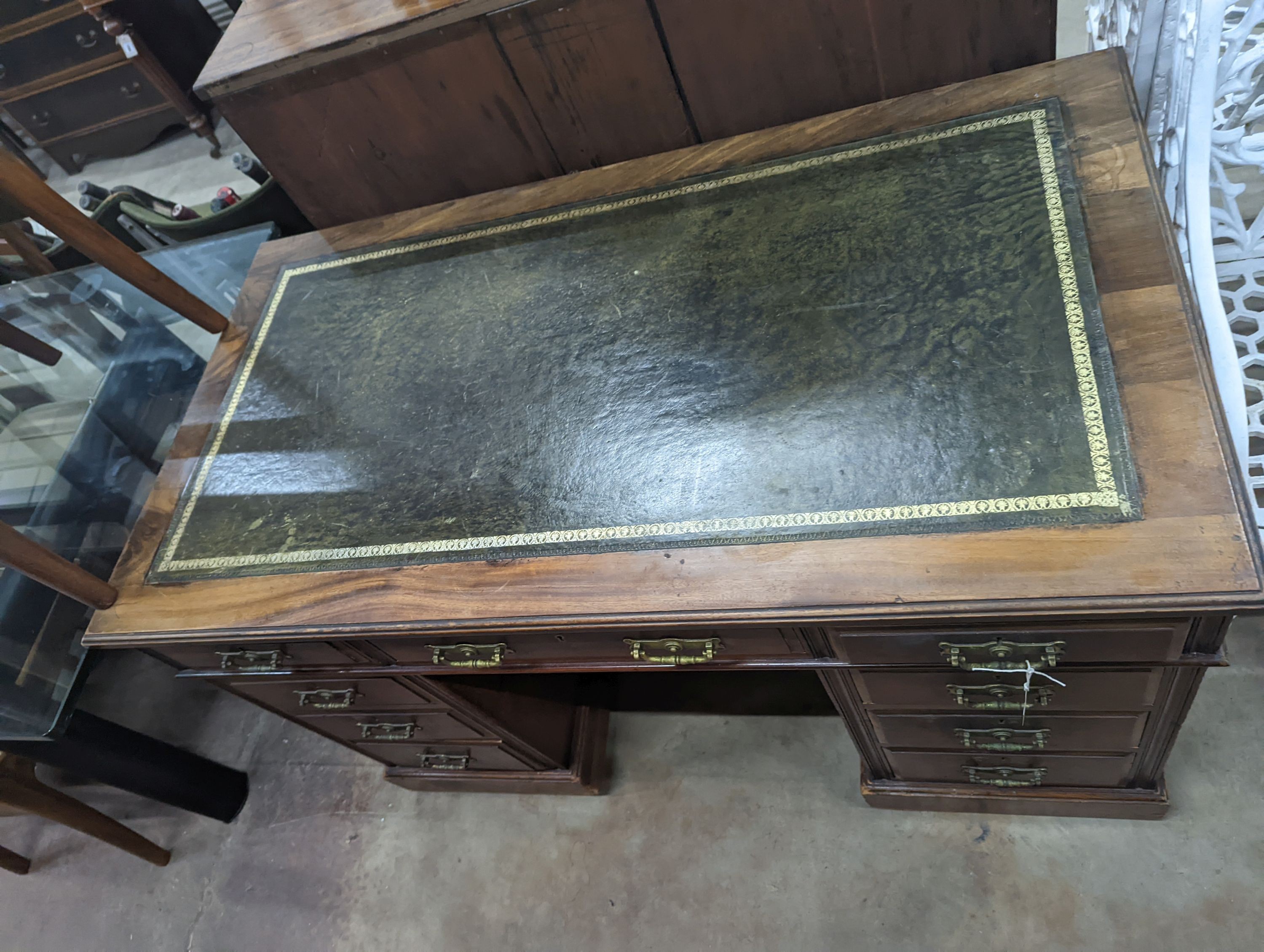 A late Victorian walnut pedestal desk, length 122cm, depth 68cm, height 76cm